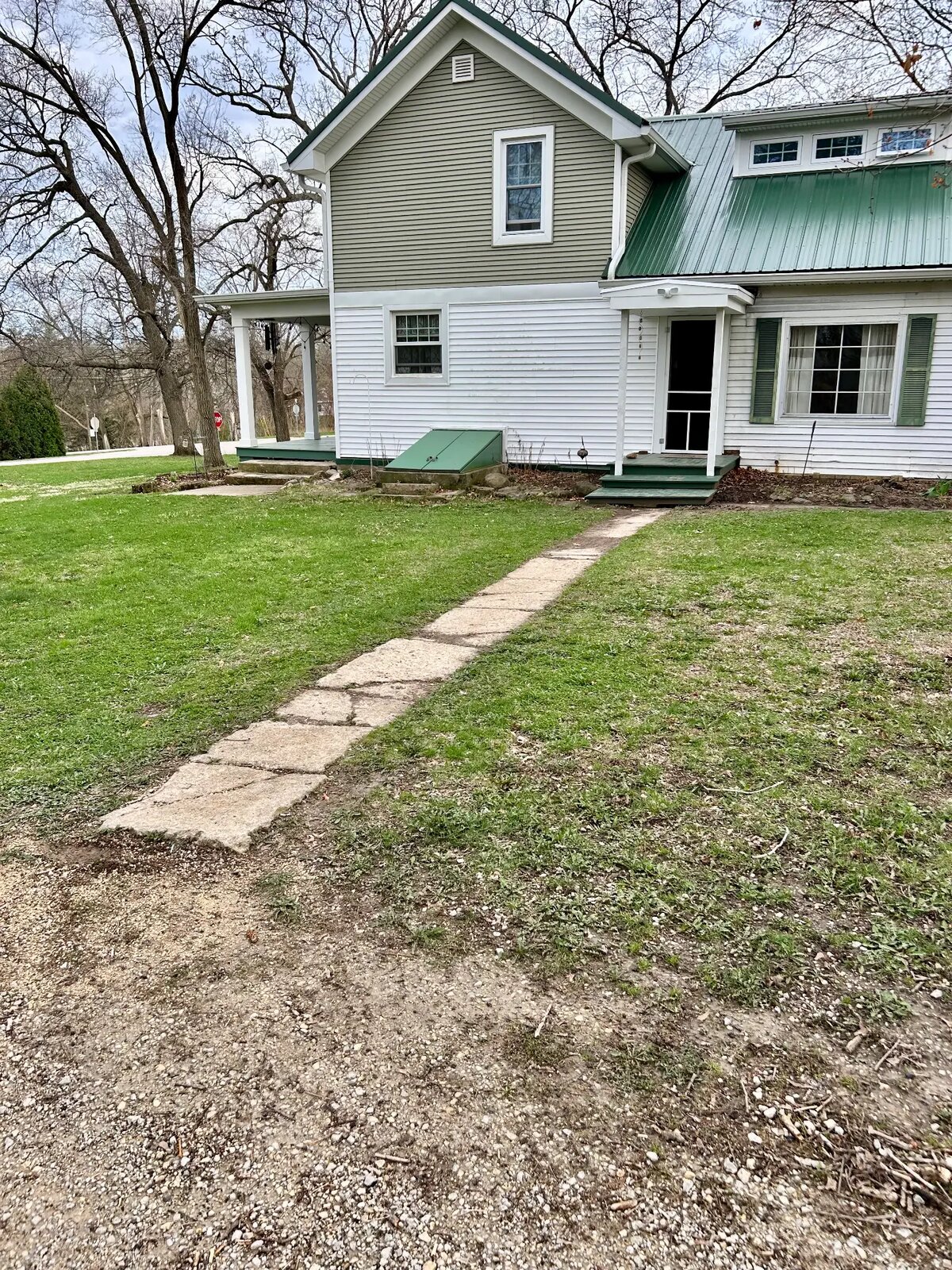 Cracked, uneven concrete walkway before replacement